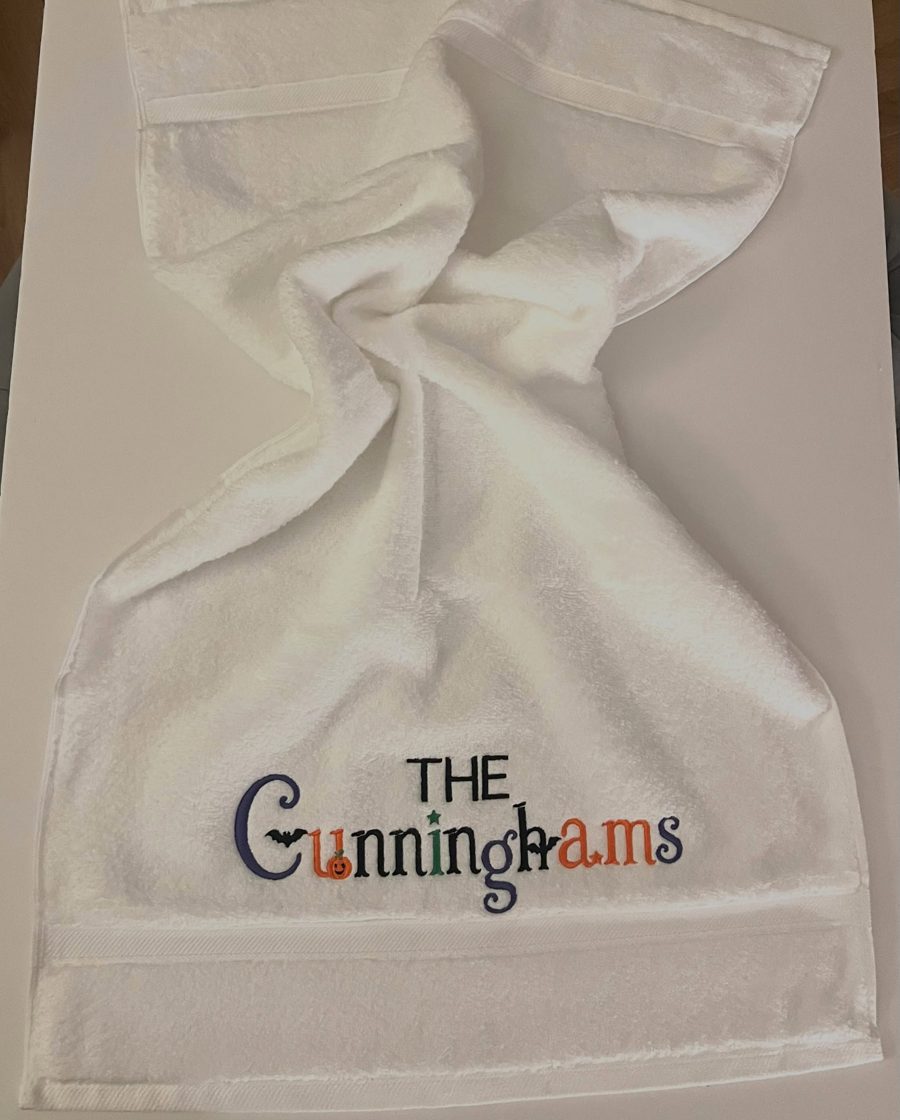 White towel embroidered 'The Cunninghams'